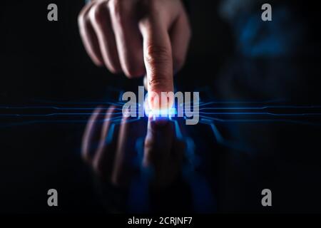 Digitalization Concept: Human Finger Pushes Touch Screen Button and Activates Futuristic Artificial Intelligence. Visualization of Machine Learning Stock Photo