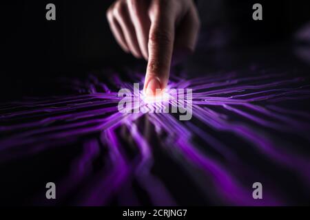 Cyber Security Hacking Concept: Human Finger Pushes Touch Screen Button and Creates Computer Virus. Pink and Purple Visualization of Digitalization of Stock Photo