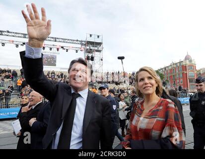 Christian Estrosi, President of the Provence Alpes Cote d'Azur region (PACA), waves next to his wife Laura Tenoudji Estrosi during the 133rd Nice carnival, the first major event since the city was attacked during Bastille Day celebrations last year, in Nice, France, February 11, 2017.   REUTERS/Eric Gaillard
