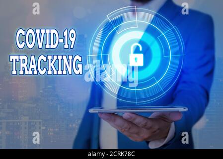 Handwriting text Covid 19 Tracking. Conceptual photo Distinguishing process of the possible infected individuals Graphics padlock for web data informa Stock Photo