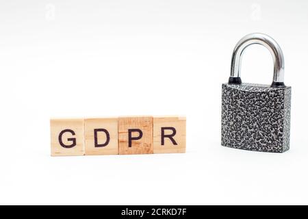 Word General Data Protection Regulation (GDPR) made from wooden blocks and metal Padlock on white background Stock Photo