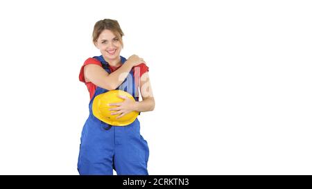 Construction woman laughing at someone behind the camera on whit Stock Photo