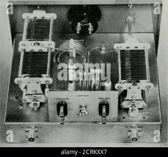 . QST . ither forward or reflected power as selected bya front-panel switch. Two output links are pro-vided, for either low-frequency (3.5 to 7.3 Mc.)output or high-frequency (14 to 30 Mc.) output.. second front-panel control is provided for theselection of various functions. The noninductive50-ohm dummy load is connected in circuit inPosition 1, while the second position switches thetransmitter to the coupler proper. Position 3switches the transmitter to a 50-ohm output con-nection which is independent of the coupler butallows the u.«e of the power-measuring devicewhen feeding directly into Stock Photo