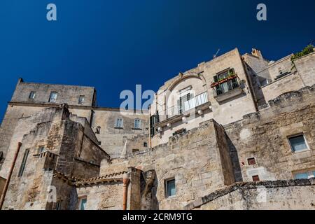 August 8, 2020 - Matera, Basilicata, Italy - The typical stone and brick houses of the old town of Matera, in the Sasso Caveoso. Stock Photo