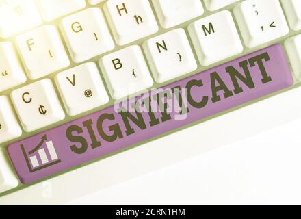 Conceptual hand writing showing Significant. Concept meaning sufficiently great or important to be worthy of attention Colored keyboard key with acces Stock Photo