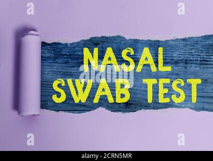 Writing note showing Nasal Swab Test. Business concept for diagnosing an upper respiratory tract infection through nasal secretion Rolled ripped torn Stock Photo