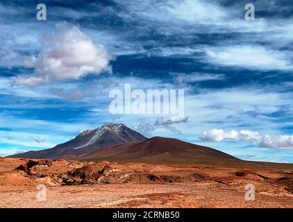 View on Ollague Volcano- massive stratovolcano on border between Bolivia and Chile.Unreal Andes volcanic mountain landscape in Andean Nature Reserve Stock Photo