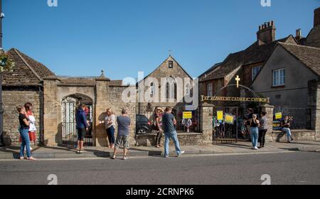 Malmesbury, Wiltshire, England, UK. 2020. Pick up point for school children during Covid-19. Parents social distancing outside St Aldhelms Catholic Ch Stock Photo