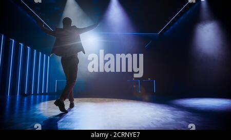 Famous Entertainer Gets on the Stage, Greets Audience, Starts Performance. Software Company Founder, Tech Marketing Guru Making a Pitch, Presentation Stock Photo