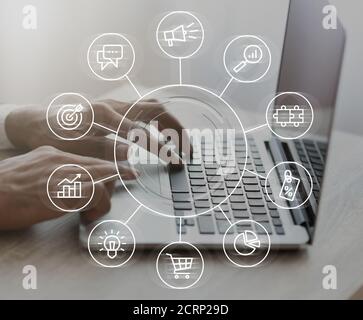 Digital Marketing Strategy Infographic Layered Over Businessman Working On Laptop, Creative Collage Stock Photo