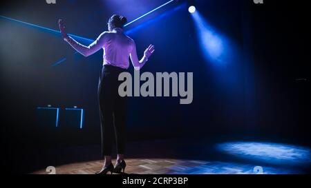 Famous Female Entertainer Stands on the Stage, Greets Audience, Starts Performance. Software Company Founder, Tech Marketing Guru Making a Pitch Stock Photo