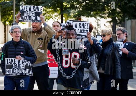 Demonstrators rally outside the NFL owners meeting in New York City, NY, U.S. October 17, 2017. REUTERS/Brendan McDermid