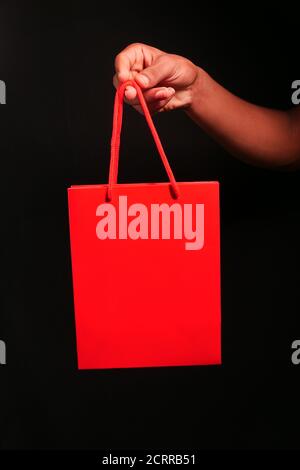 red color gift bag isolated on black  Stock Photo