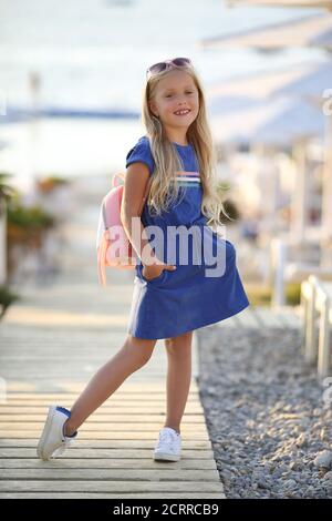 pretty preteen blonde girl outdoors in summer Stock Photo
