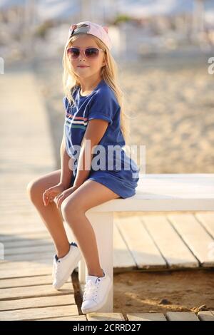 pretty preteen blonde girl outdoors in summer Stock Photo