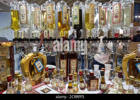 BELGRADE, SERBIA - FEBRUARY 24, 2019: Various bottles of rakija, of different fruits sizes and flavours, on display in a bar. Rakija is a traditional Stock Photo