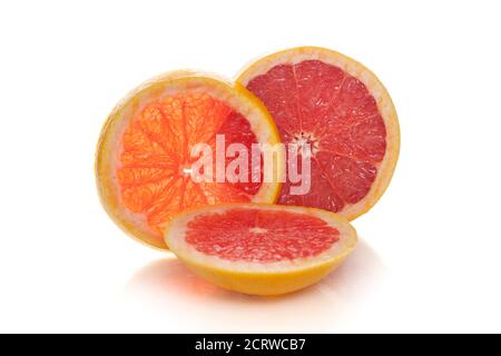 Grapefruit citrus fruit halves isolated on white background slices of grapefruit with clipping path Stock Photo