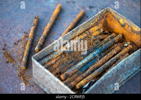 Old metal studs covered in rust, close-up, selective focus Stock Photo