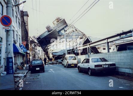 Building collapsed sideways down the road from the damage caused by the ...