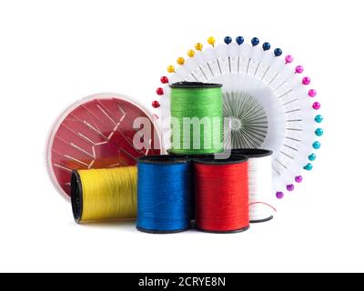 Composition with tailor needles and threads over white background Stock Photo