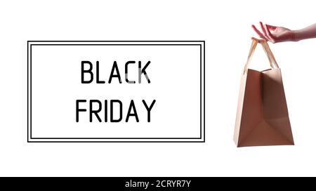 Black Friday. Paper Bag in Woman Hand. Concept Sale. Banner. Stock Photo