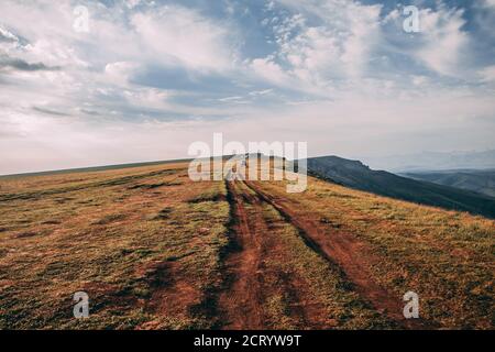 mountain path and yellow grass Stock Photo