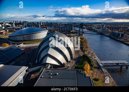 Fall in the city. SEC Armadillo and SSE Hydro modern buildings, Finnieston Crane, Clyde river embankment. Aerial panoramic city view. Stock Photo