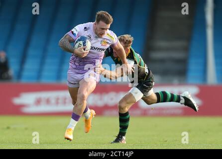 Exeter City's Stuart Hogg (left) is tackled by Northampton Saints' Rory Hutchinson during the Heineken Champions Cup quarter final match at Sandy Park, Exeter. Stock Photo