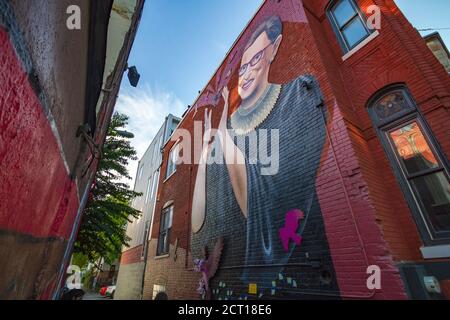 Washingtonians pay their respects to Justice Ruth Bader Ginsburg with messages and flowers at a mural in NW Washington, Saturday, 19 September 2020. Stock Photo