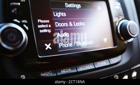 Modern luxury car interior. Touch Screen monitor with settings. Shallow dof Stock Photo