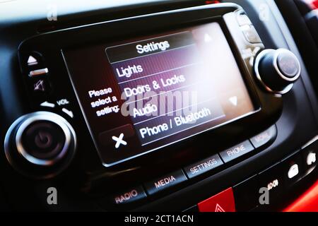 Modern luxury car interior. Touch Screen monitor with settings. Shallow dof Stock Photo