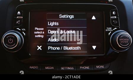 Modern luxury car interior. Touch Screen monitor with settings. Shallow dof Stock Photo