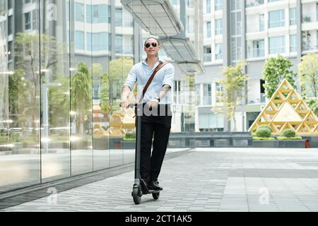 Man enjoying riding on scooter Stock Photo