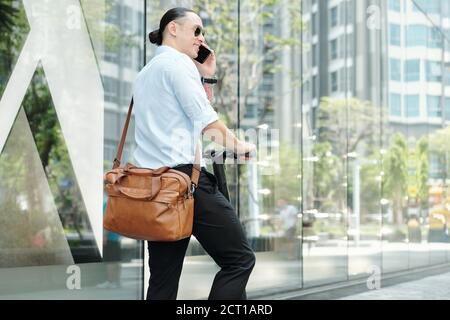 Young entrepreneur calling on phone Stock Photo