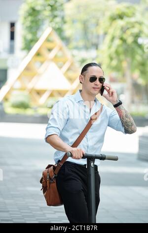 Young businessman making phone call Stock Photo