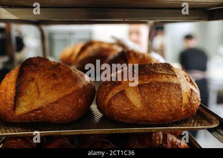 Close up image of freshly baked bread cooling on a shelf Stock Photo