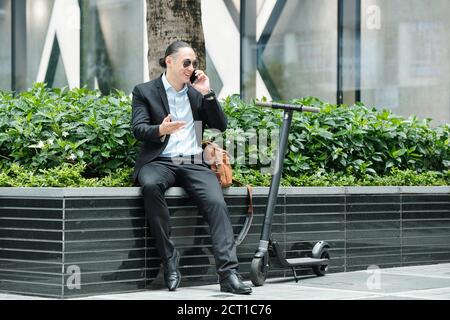 Man calling business colleague Stock Photo