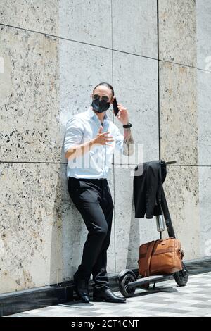 Angry businessman talking on phone Stock Photo