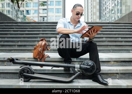 Entrepreneur using application on tablet Stock Photo