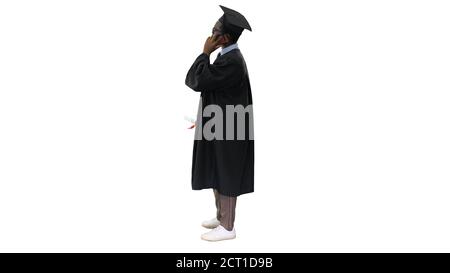 Smiling african american male student in graduation robe talking Stock Photo