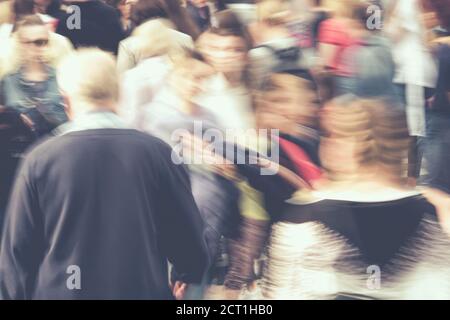 Blurred busy city traffic from people in summer. Stock Photo