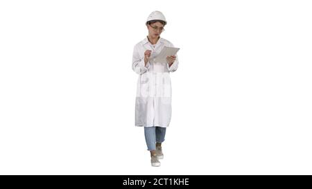 Woman engineer working on tablet on white background. Stock Photo