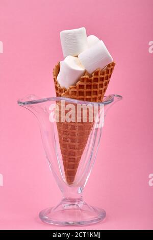 Ice cream cone with marshmallows in a glass cup. Stock Photo