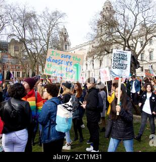 London, England, United Kingdom - 02/14/2020 : Students holding banners, striking and protesting for climate action at Parliament Square Stock Photo