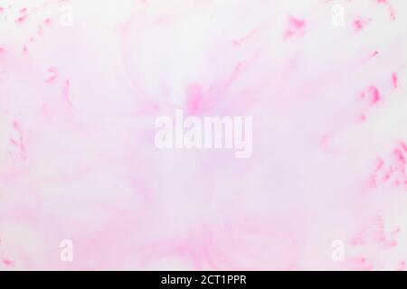 Fluid art texture. White pink background from liquid. Photography of colored spots on liquid. Abstract pattern for design Stock Photo