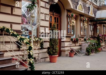 Shop window decorated in Christmas style. Christmas and New Year sales. Many different handbags and other items are sold in stores. Stock Photo