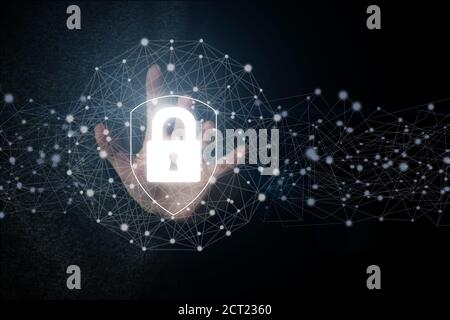 Hand touching the shield protection icon, the concept of cybersecurity security of your data. Protection for data access, Concept cyber security safe Stock Photo