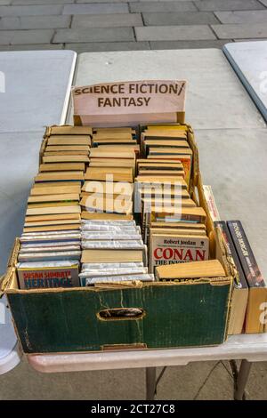 Box of secondhand science fiction and fantasy books for sale on a book stall. Stock Photo