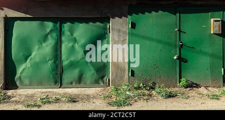 Old fashioned garage door. Hand up and no autimatic garage door. Close- up photo. Stock Photo