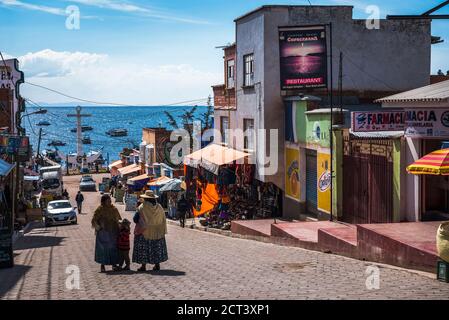 Traditional Cholita women in Copacabana, Bolivia, South America Stock Photo